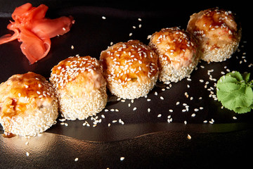 Sushi in sauce with wasabi and ginger.