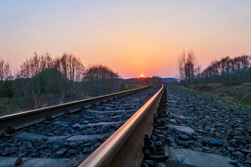 Fototapeta premium railway tracks in the sunset