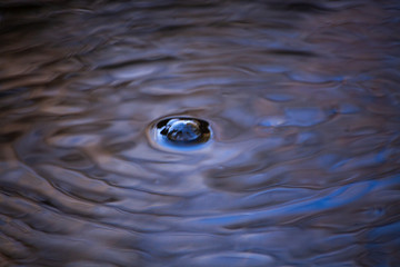 Bubbles. Mirror photography. Water flow Natural background water. Fresh water is the source of...