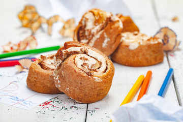Homemade cottage cheese cookies with custard and walnuts on wooden background. Close up