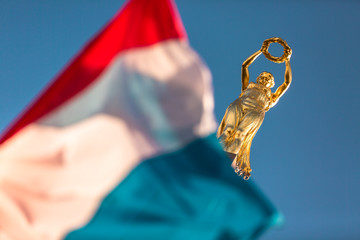Iconic golden statue symbol of Luxembourg in Place de la Constitution - obrazy, fototapety, plakaty
