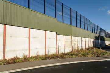 Fototapeta na wymiar Peace wall in Belfast, Northern Ireland, to divide roman catholic and protestant communities.