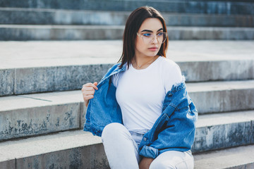 Girl wearing t-shirt with place for logo and cotton jacket , urban clothing style