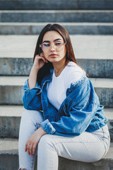 Girl wearing t-shirt with place for logo and cotton jacket , urban clothing style