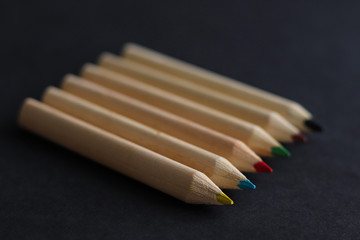 color pencils on black background