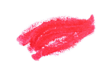 Fototapeta premium Close up of a lipstick stroke with visible texture isolated on white as a make-up sample. Beauty and fashion concept.