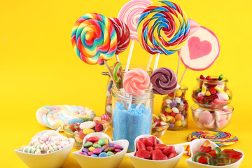 candies with jelly and sugar. colorful array of different childs sweets and treats.