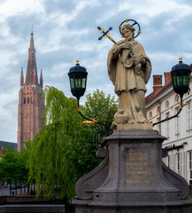 Statue of St John Nepomuk on bridge on Wollestraat, Bruges / Brugge, Flanders, Belgium, Europe