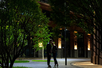 couple in love walks at night in the city