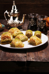 Middle eastern or arabic dishes. Turkish Dessert Baklava with pistachio on dishes