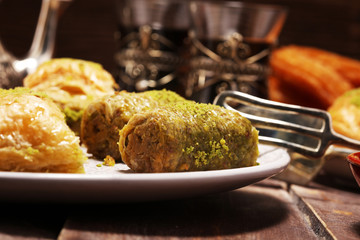 Middle eastern or arabic dishes. Turkish Dessert Baklava with pistachio on dishes