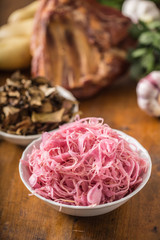 Sour cabbage with smoked ribs sausages potatoes and garlic