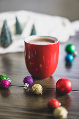 red cup of coffee with holiday decorations