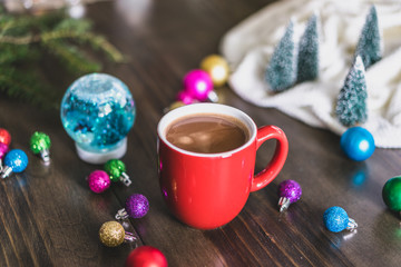 mug of hot chocolate and christmas decorations