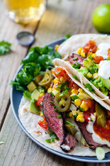 Soft tacos with fillet steak, sweetcorn, coleslaw, avocado and tomato salsa