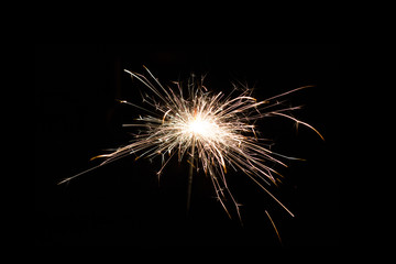 Sparkler candle at summer night holiday party