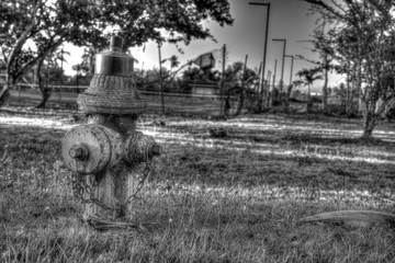 Black and White fire hydrant at abandoned tennis court in Puerto Rico