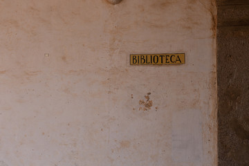spanish library sign on wall saying biblioteca found in Guatemala
