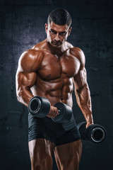 Handsome Bodybuilder Lifting Weights. Execising With Dumbbells, Performing Dumbbell Biceps Curls