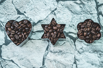 coffee beans in different shapes on graffiti wall