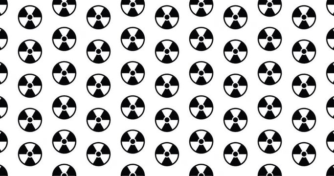 Nuclear symbols background clip energy themed motion backdrop video in a seamless repeating loop.  Black & white nuclear warning sign icon pattern background high definition motion video clip