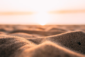 Sunset - dawn on the beach, sand close-up