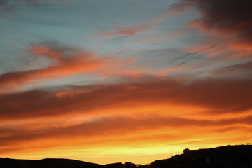 Bright orange and yellow sky at sunset or sunrise