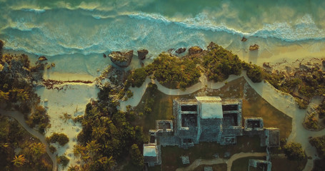 Top birds-eye view of ancient Maya sun temple in Tulum, Mexico shot by drone