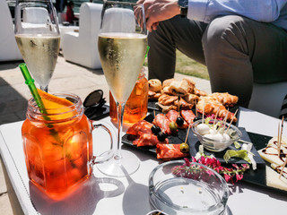 aperitif with sparkling wine and cocktails at a beach club