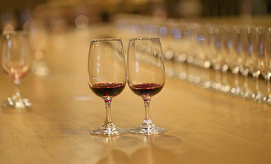 A glass of red wine is on the table