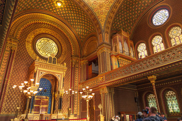 Fototapeta na wymiar Remarkable beautiful golden interior view of Spanish Synagogue, influenced by moorish interior design in Alhambra, at Jewish Town in Prague, Czech Republic.