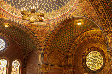 Remarkable beautiful golden interior view of Spanish Synagogue, influenced by moorish interior design in Alhambra, at Jewish Town in Prague, Czech Republic.