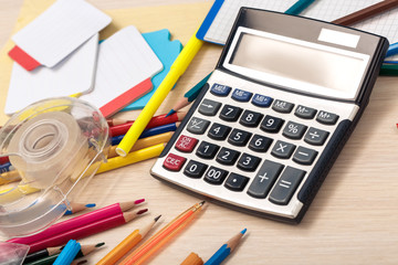 Workspace. Desk top view no people calculator and stationery