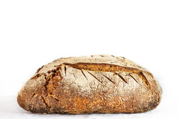 Loafs (or miche) of French sourdough, called as well as Pain de campagne, on display isolated on a white background. Pain de Campagne is a typical French huge loaf of bread 