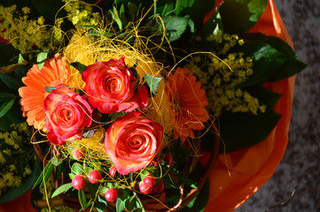 bouquet of roses with gerberas and yellow mimosa,