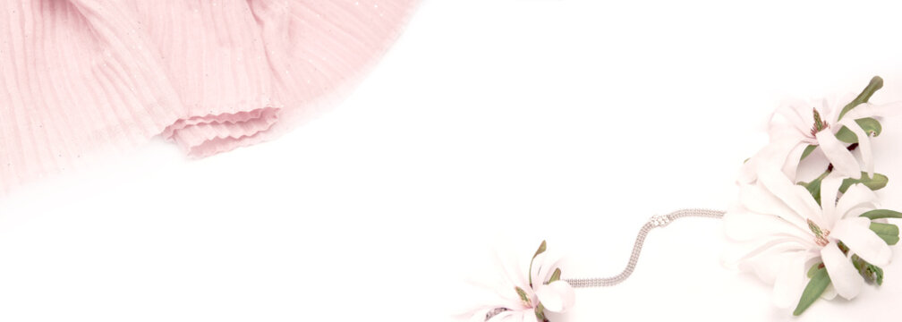 soft beige goffered silk on a white background with beautiful magnolia flowers.banner