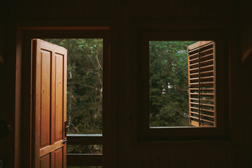 Door and window of wooden house in the mountains.