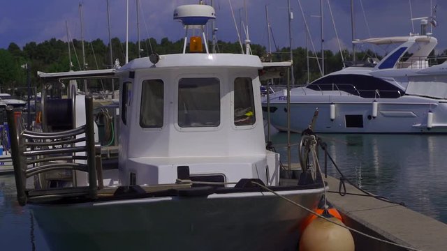 small privat yachts are moored in pier in city on sea, calm landscape