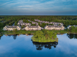 Fototapeta na wymiar Aerial photo of the lake among the countryside living community.