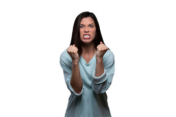 Woman with extreme rage, clinched fists and jaw, angry, emotional, and furious, isolated on white...