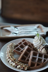 Homemade Belgian waffles with with bananas and ice cream
