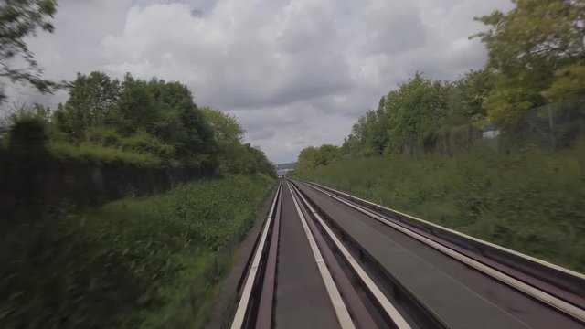 View from the front of the wagon of an automated shuttle rolling in the countryside near Paris