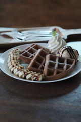 Homemade Belgian waffles with with bananas and ice cream
