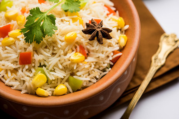 Corn Pilaf or Pulav made using boiled Maize seeds with rice and vegetables. selective focus