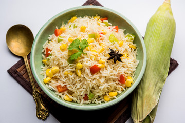Corn Pilaf or Pulav made using boiled Maize seeds with rice and vegetables. selective focus