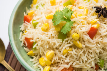 Corn Pilaf or Pulav made using boiled Maize seeds with rice and vegetables. selective focus