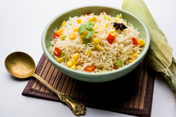 Corn Pilaf or Pulav made using boiled Maize seeds with rice and vegetables. selective focus