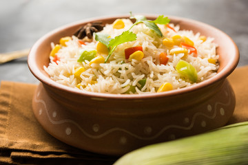 Corn Pilaf or Pulav made using boiled Maize seeds with rice and vegetables. selective focus