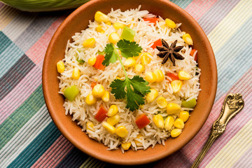 Corn Pilaf or Pulav made using boiled Maize seeds with rice and vegetables. selective focus