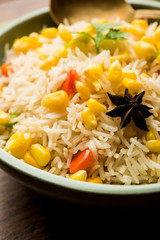 Corn Pilaf or Pulav made using boiled Maize seeds with rice and vegetables. selective focus